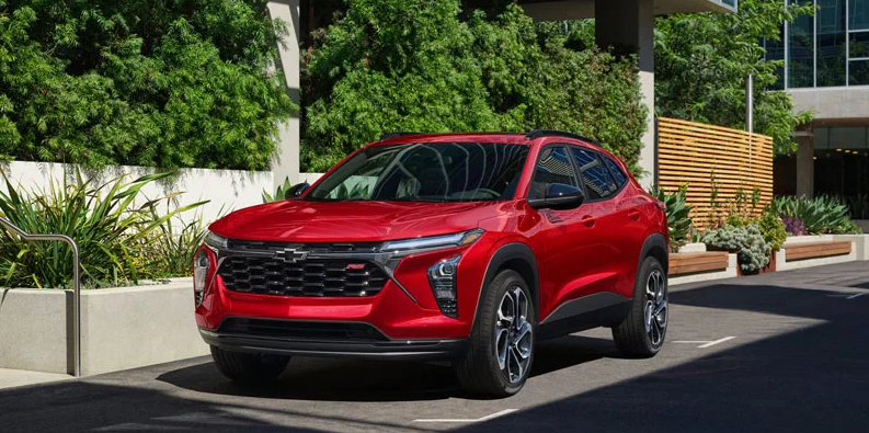 A red 2026 Chevrolet Trax parked on the side of the road.